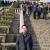 �~��